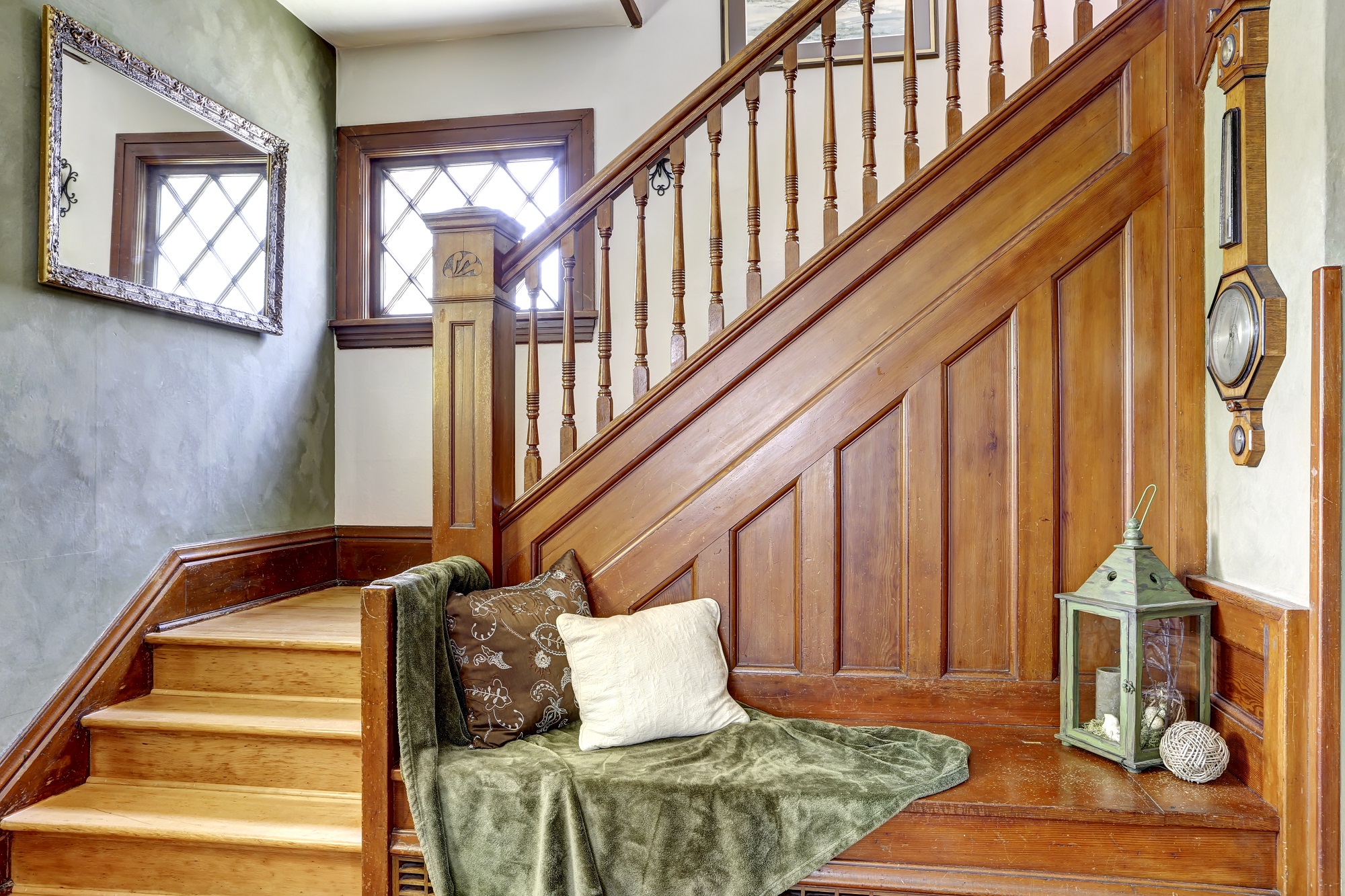 Wooden staircase with bench in old house